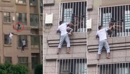 Китайцы вскарабкались по стене, спасая ребенка, висевшего на шее между решетками